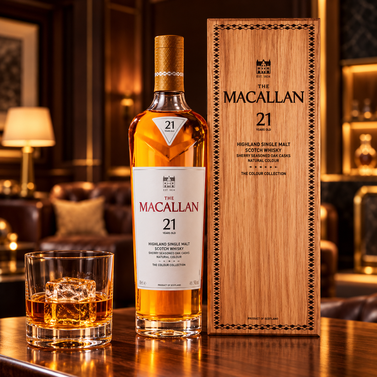 Front-facing Macallan 21 Colour Collection bottle and wooden box beside a whisky glass with one large ice cube in an elegant lounge